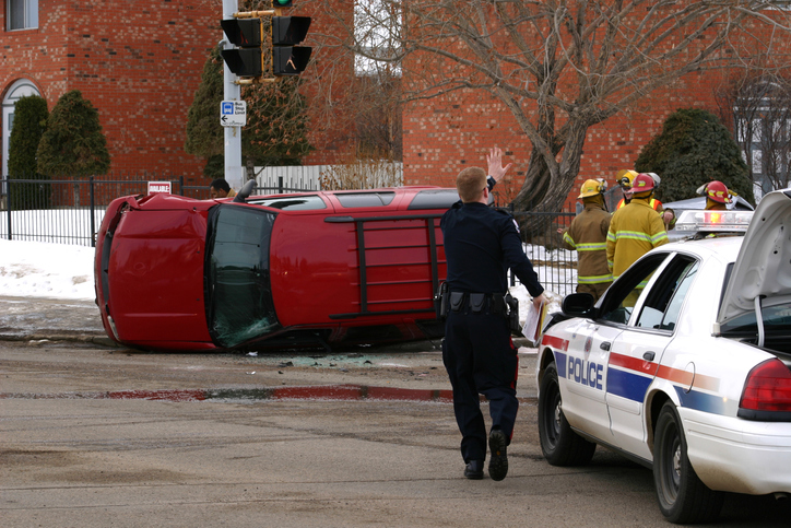 Emergency personnel attending to a rollover accident.