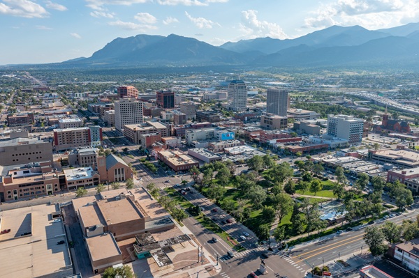 Aerial view of downtown Colorado Springs with roads, buildings, and green spaces visible, used to illustrate urban traffic patterns or accident trends in the city.