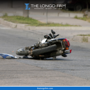 Motorcycle lying on its side in the road after a Colorado Springs motorcycle accident